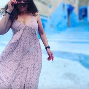 Long, flowing maxi dress that is an elegant silhouette and versatile style.